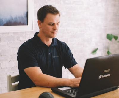Web Design Company - Man working on Laptop in office
